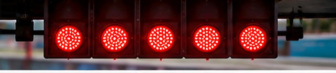 The five red starting lights on the gantry above a Formula 1 grid